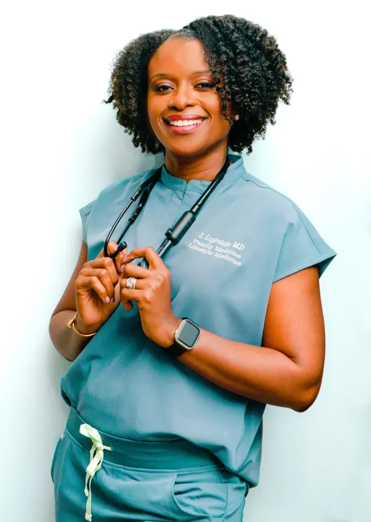 Portrait of Dr. Sandra E. Luyindula, founder of The Well MD