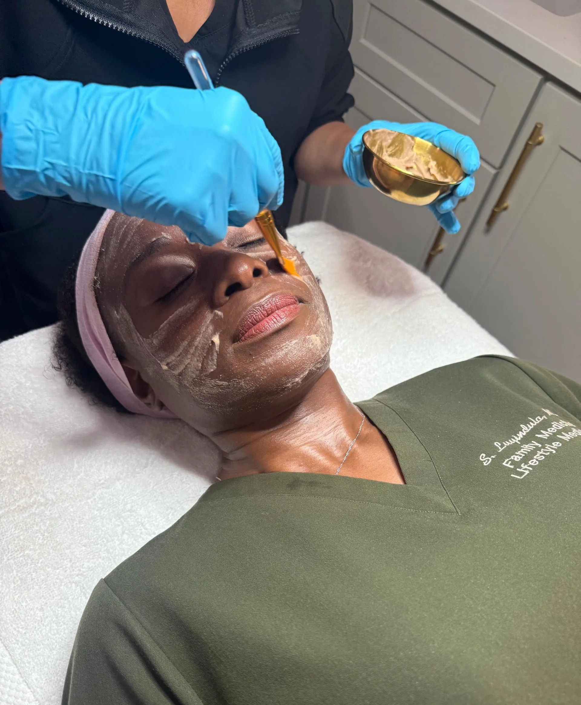 Aesthetician applying a facial treatment