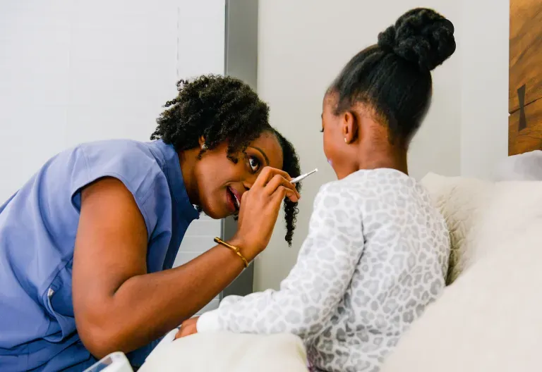 Physician examining a child patient